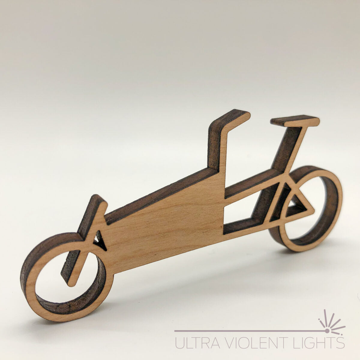 A box bike figure in maple