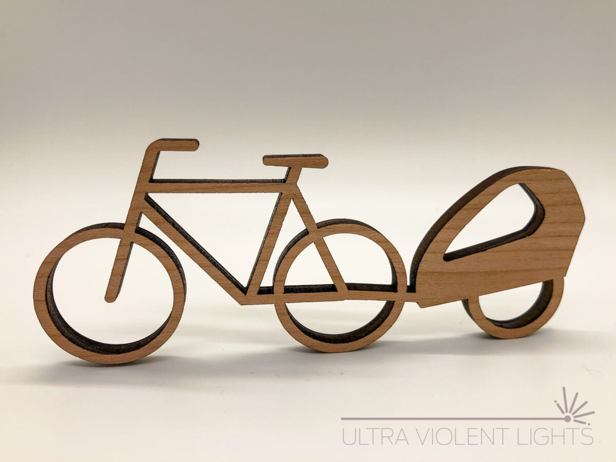 A trailer bike figure in maple