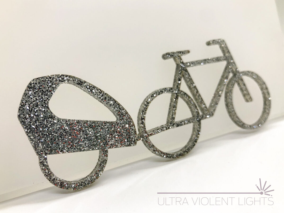 A trailer bike figure in silver acrylic
