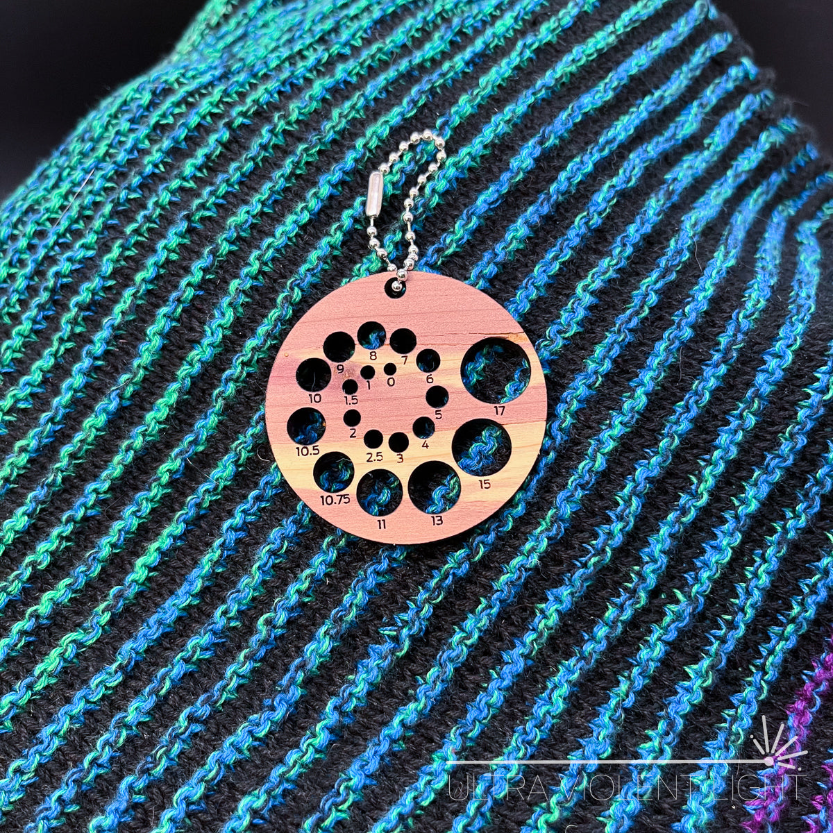Spiral knitting needle sizer