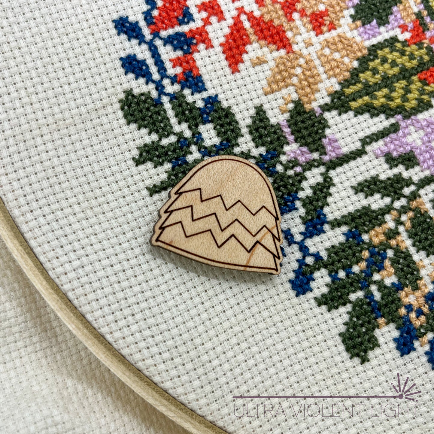 Needle in a haystack needle minder