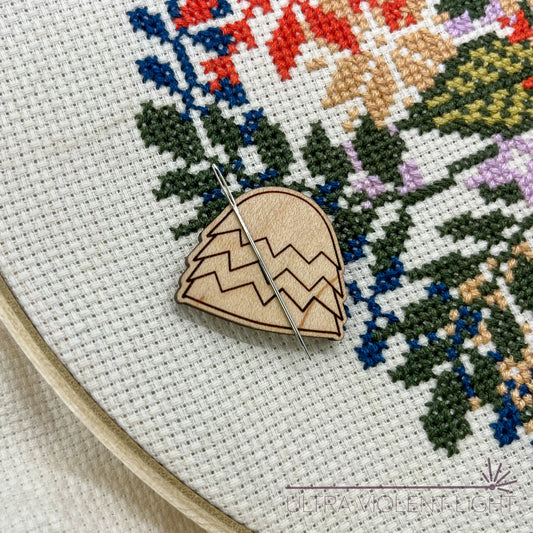 Needle in a haystack needle minder