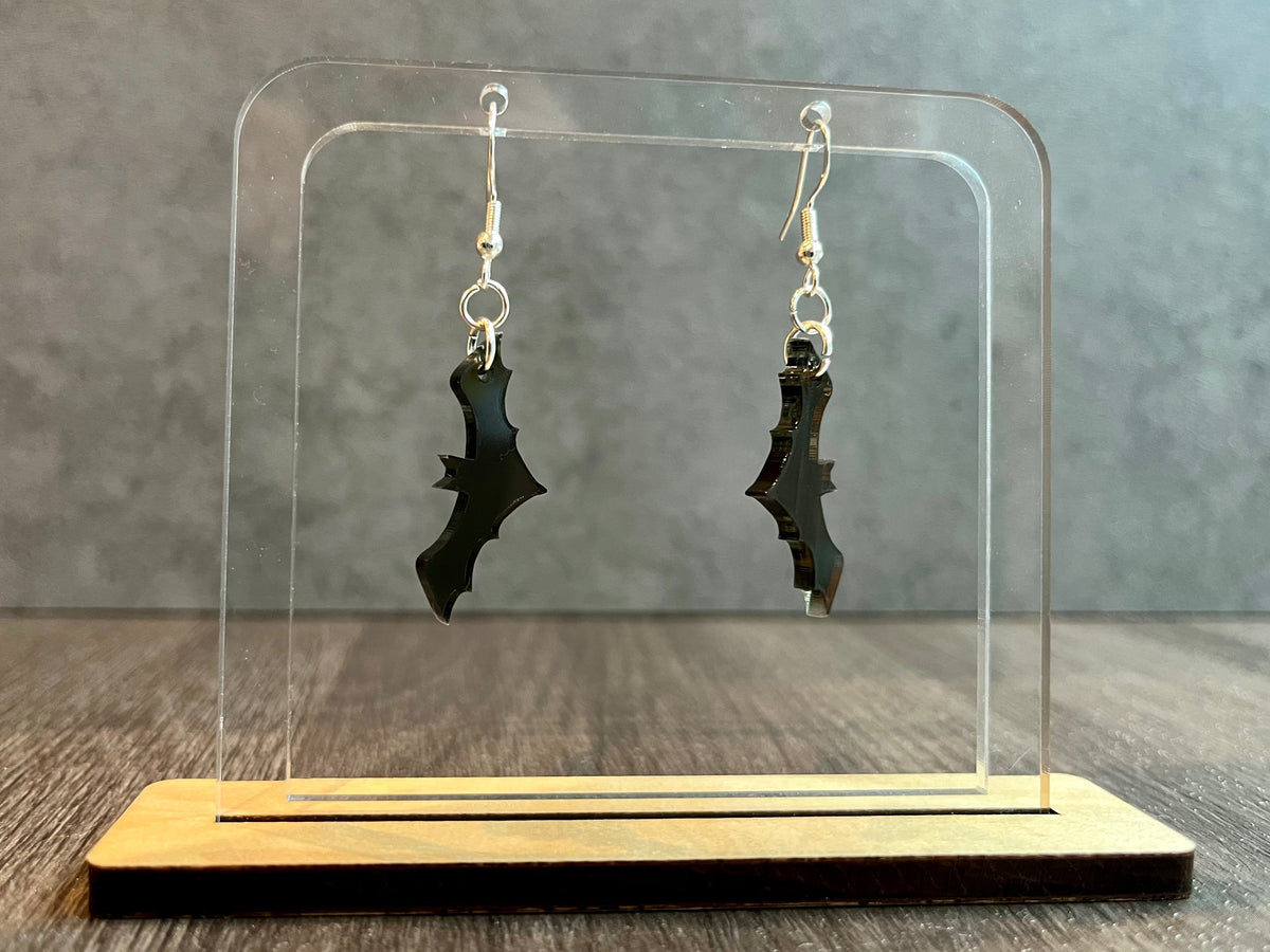 Bat earrings handmade laser-cut acrylic flat lay on light background