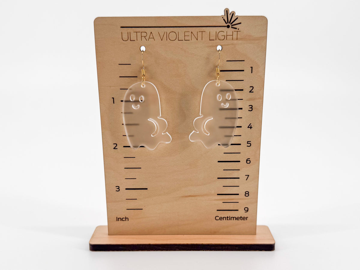 Ghost BOOty earrings with gold-colored hook findings on a wooden display with inch and centimeter markings for scale.