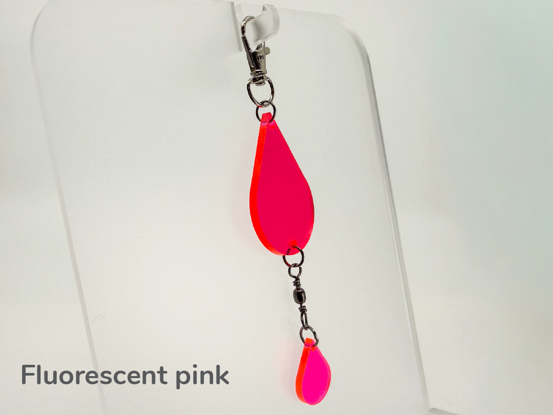 Fluorescent pink teardrop-shaped small sun catcher / keychain on a white background