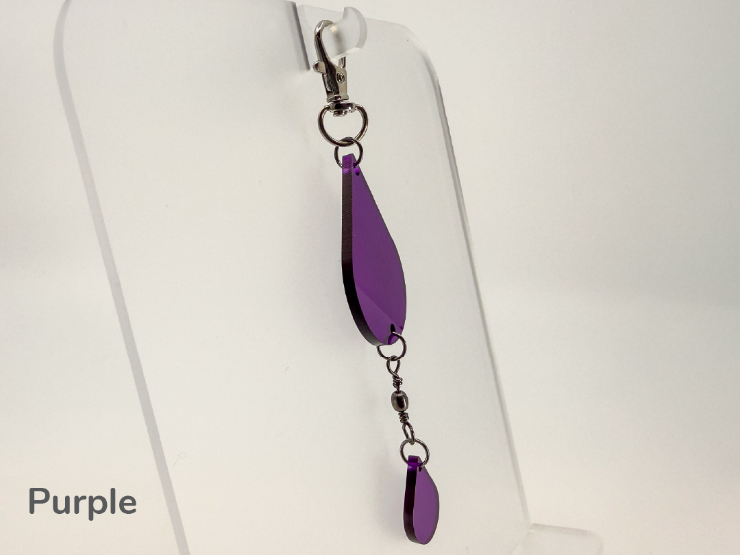 Purple teardrop-shaped small sun catcher / keychain on a white background