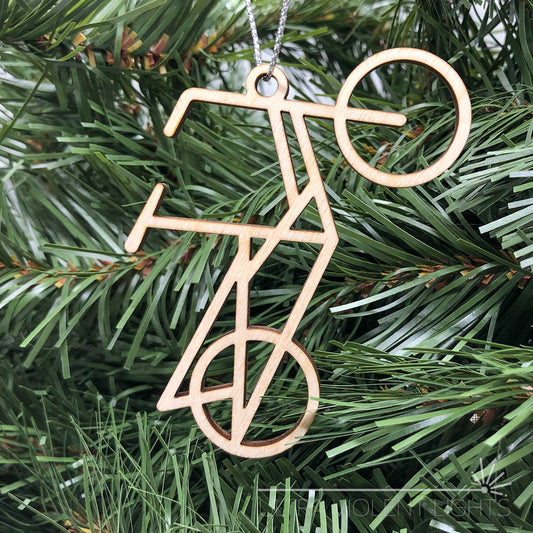Wooden midtail bicycle ornament on greenery