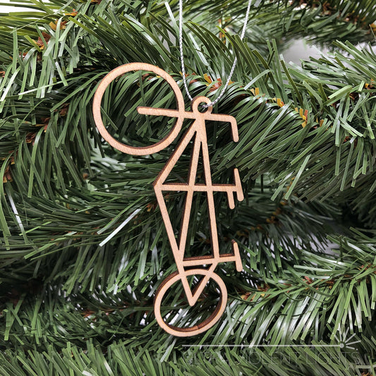 Wooden tandem bicycle ornament on greenery