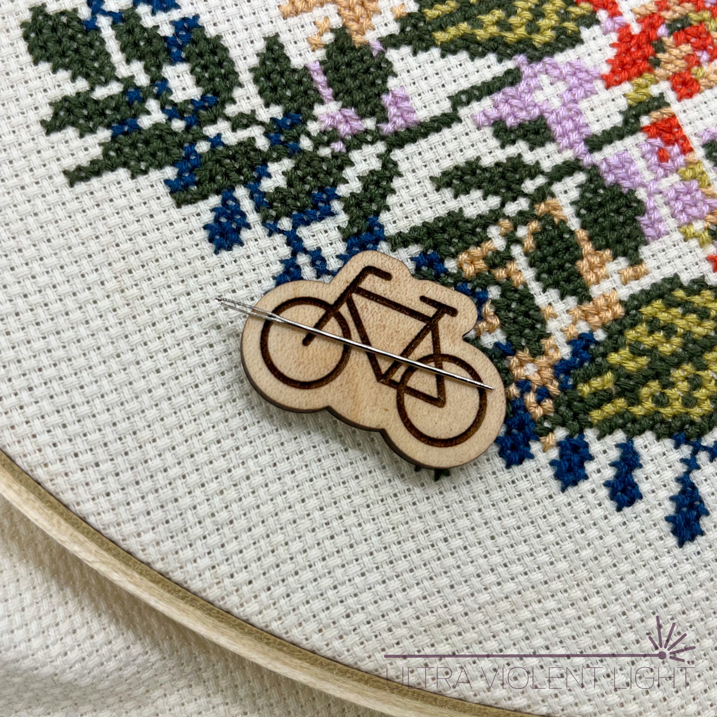 Bicycle needle minder